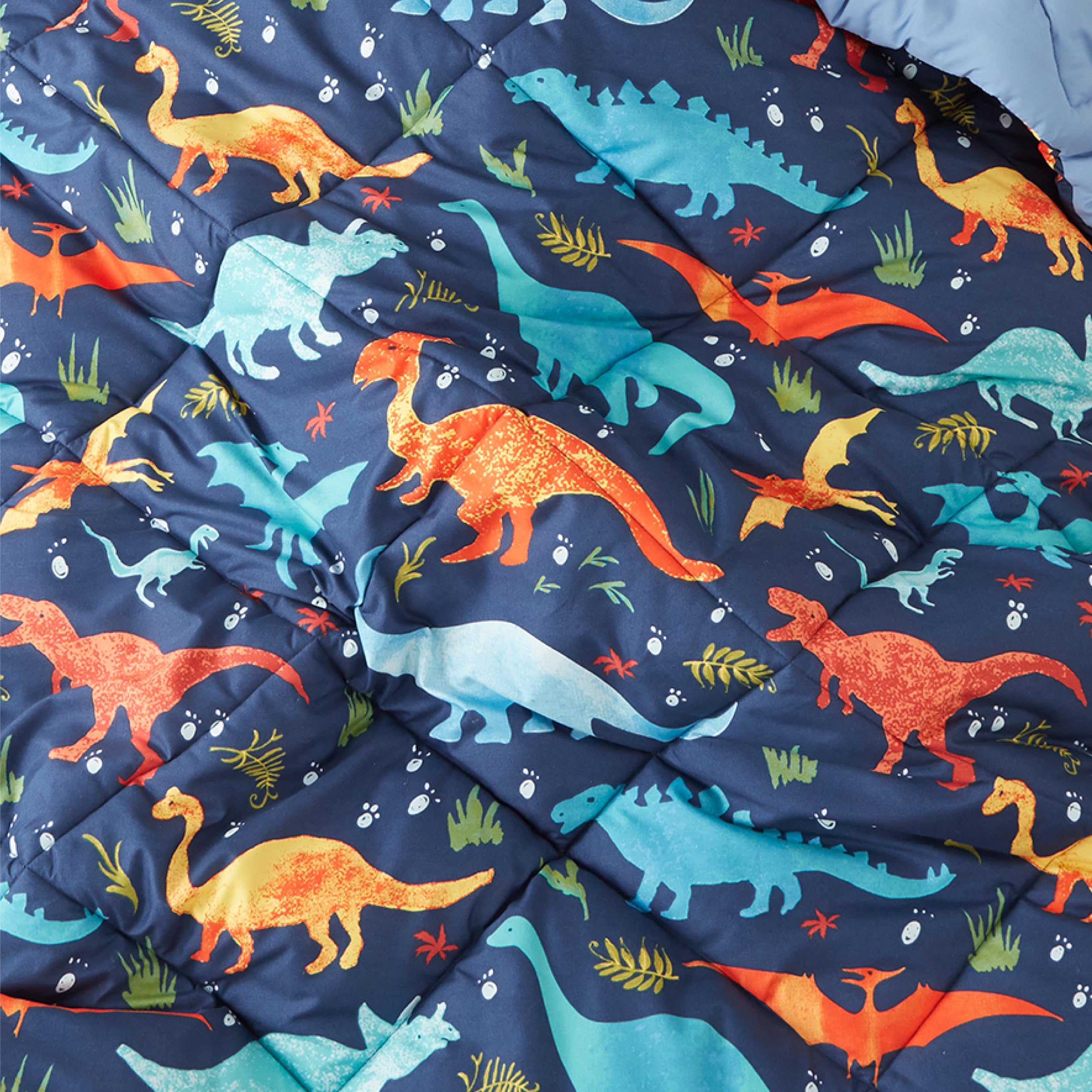 PPOLCA twin bed styled with dinosaur comforter for cheerful kids room