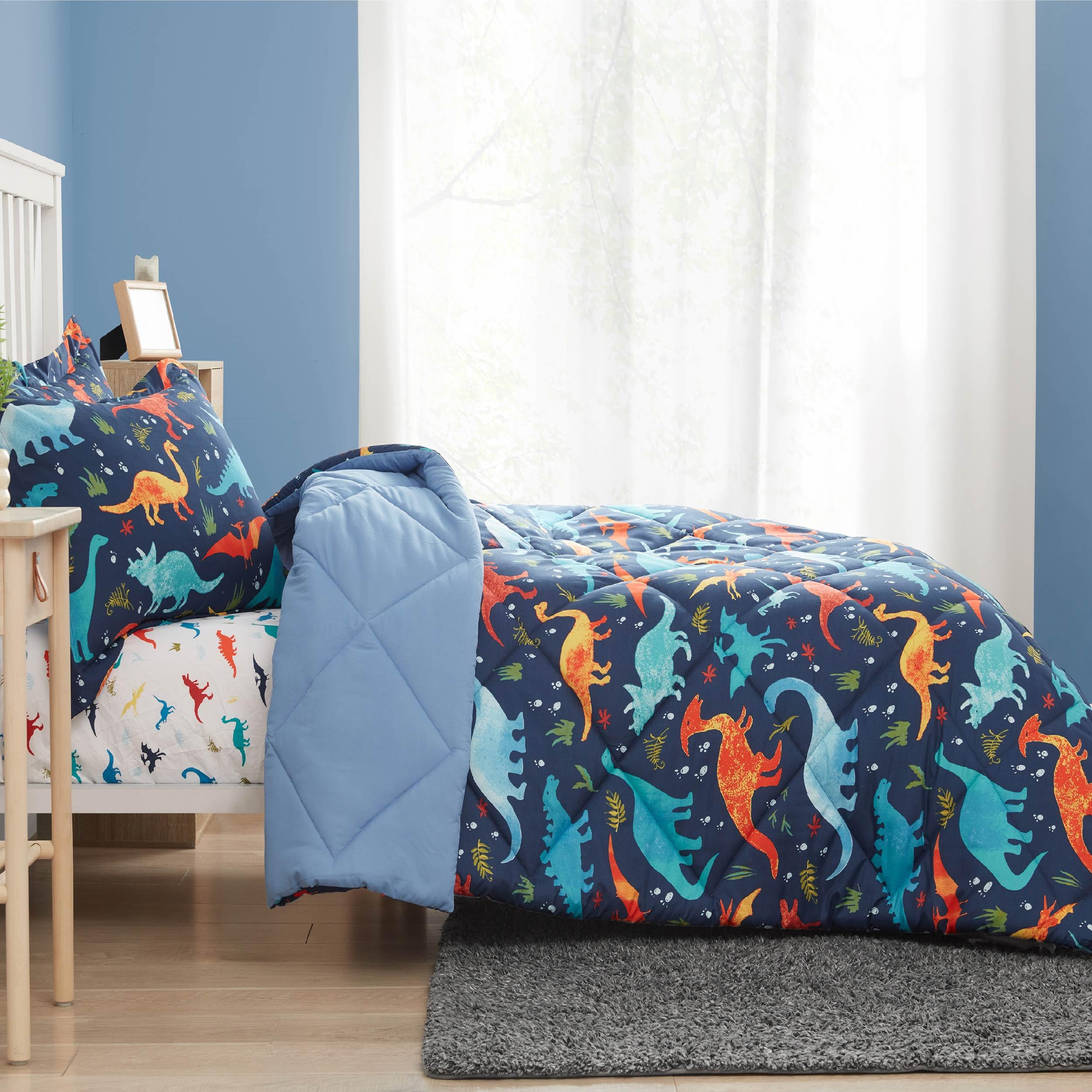 PPOLCA child tucked under comforter illustrating cozy lightweight warmth