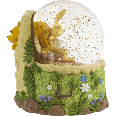 Precious Moments globe displayed on a dresser adding nostalgic decor appeal