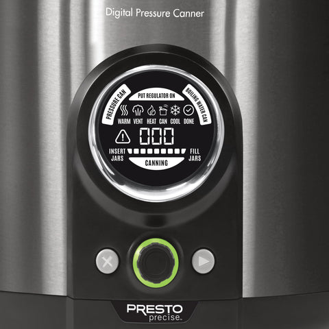 Presto canner beside a hand for scale, benefit: shows compact 12‑quart capacity
