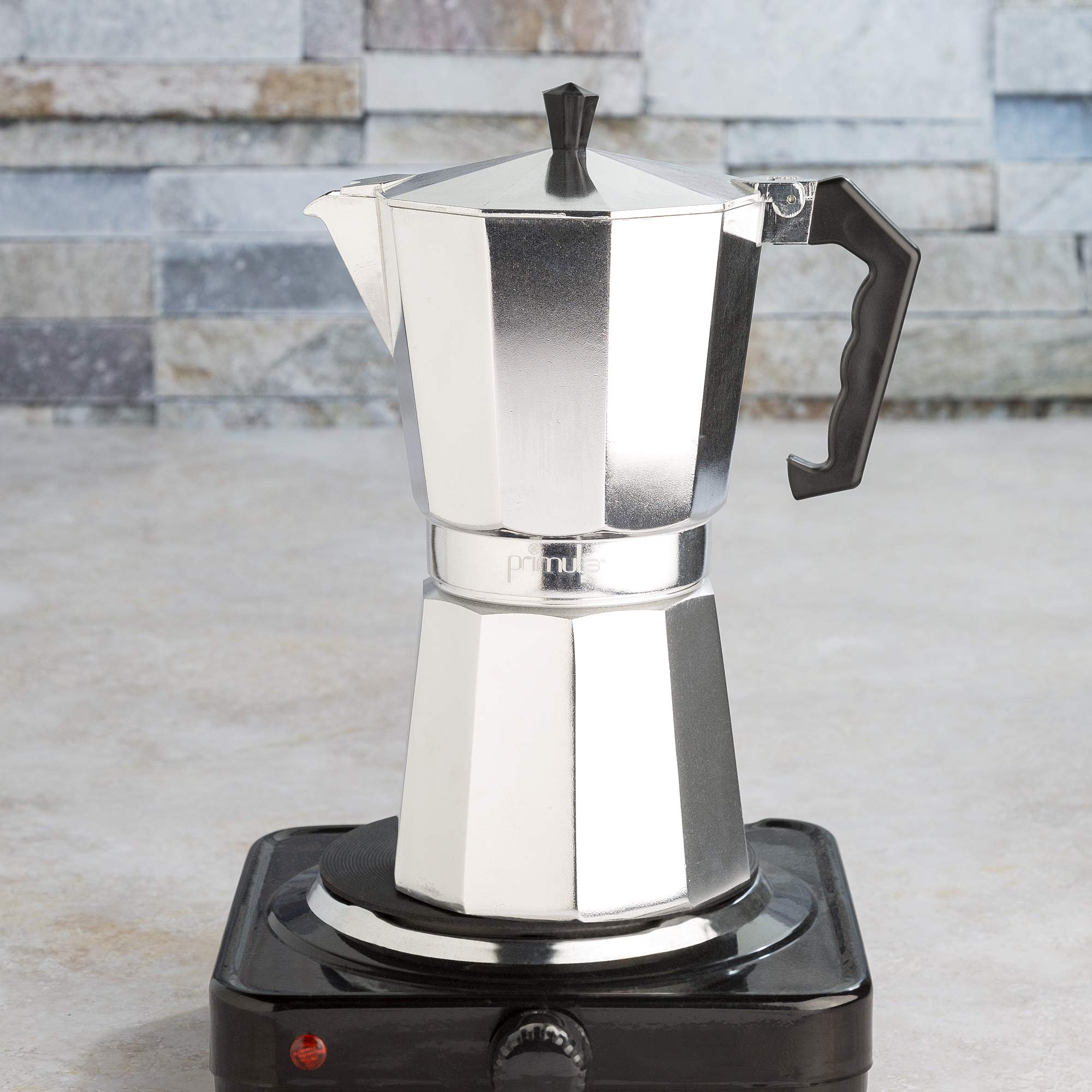 Primula camping setup showing portable moka pot on propane stove for travel