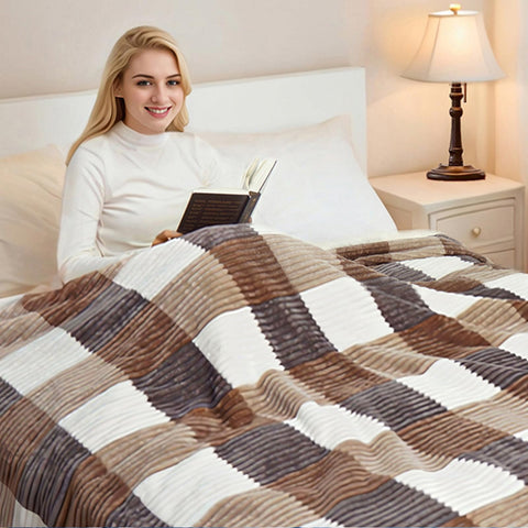 PU MEI blanket draped over couch demonstrating warmth and living room styling