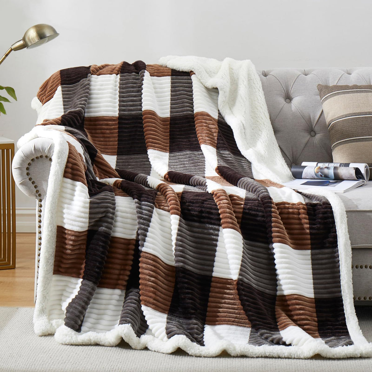 PU MEI front folded blanket showing plaid design and cozy look