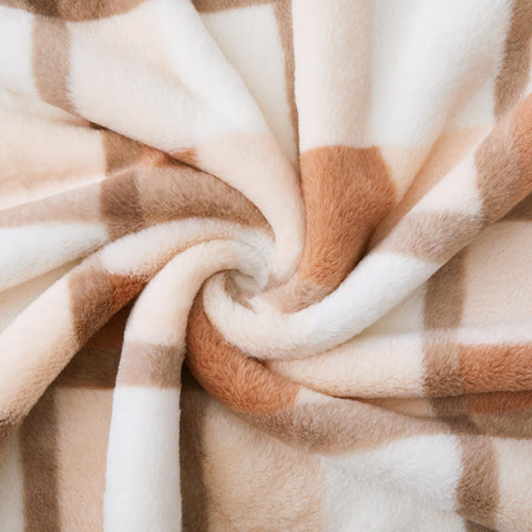 PU MEI throw draped over sofa demonstrating stylish living room use