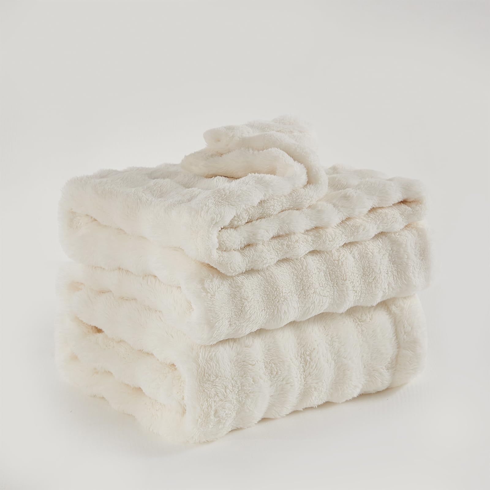 PU MEI blanket next to pillow showing scale and generous 80x90 coverage