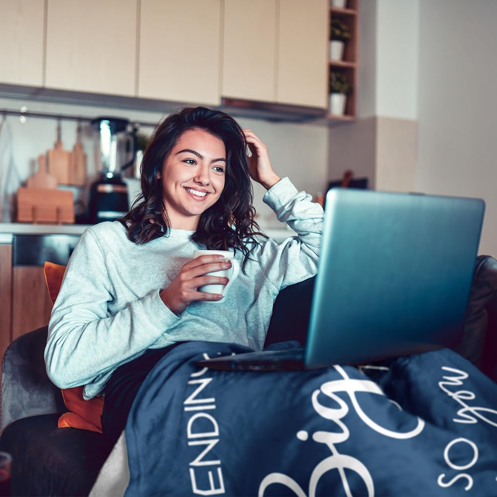 Pubrave blanket in use on couch providing comforting coverage and visible message benefit