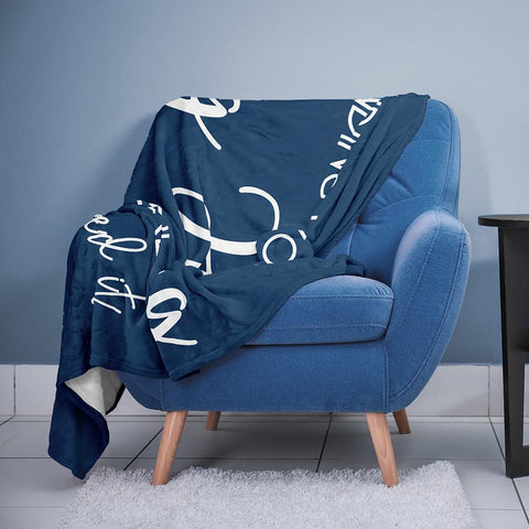 Pubrave blanket beside a book to show scale and easy travel benefit