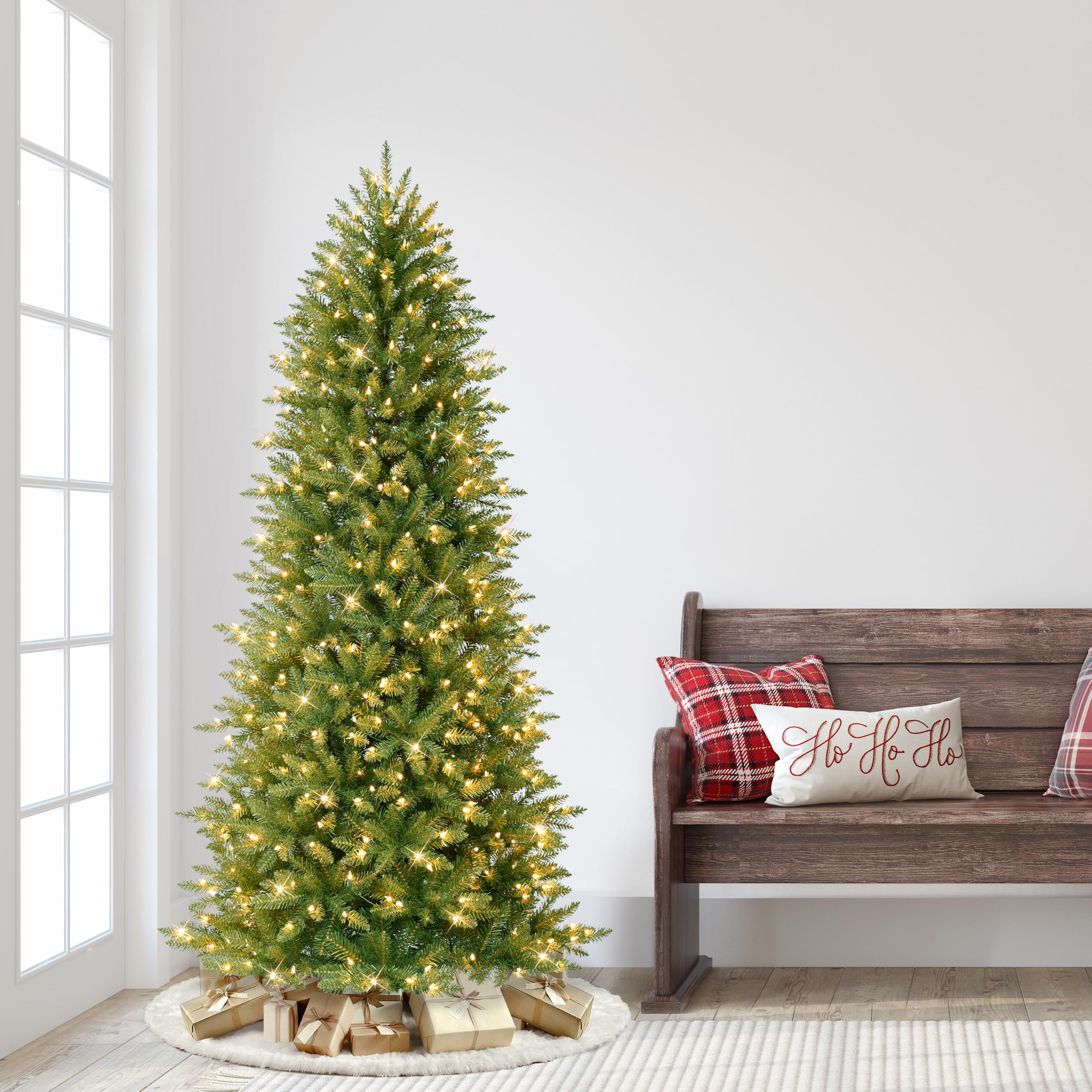 Puleo International tree beside chair showing scale and 6.5 foot height benefit