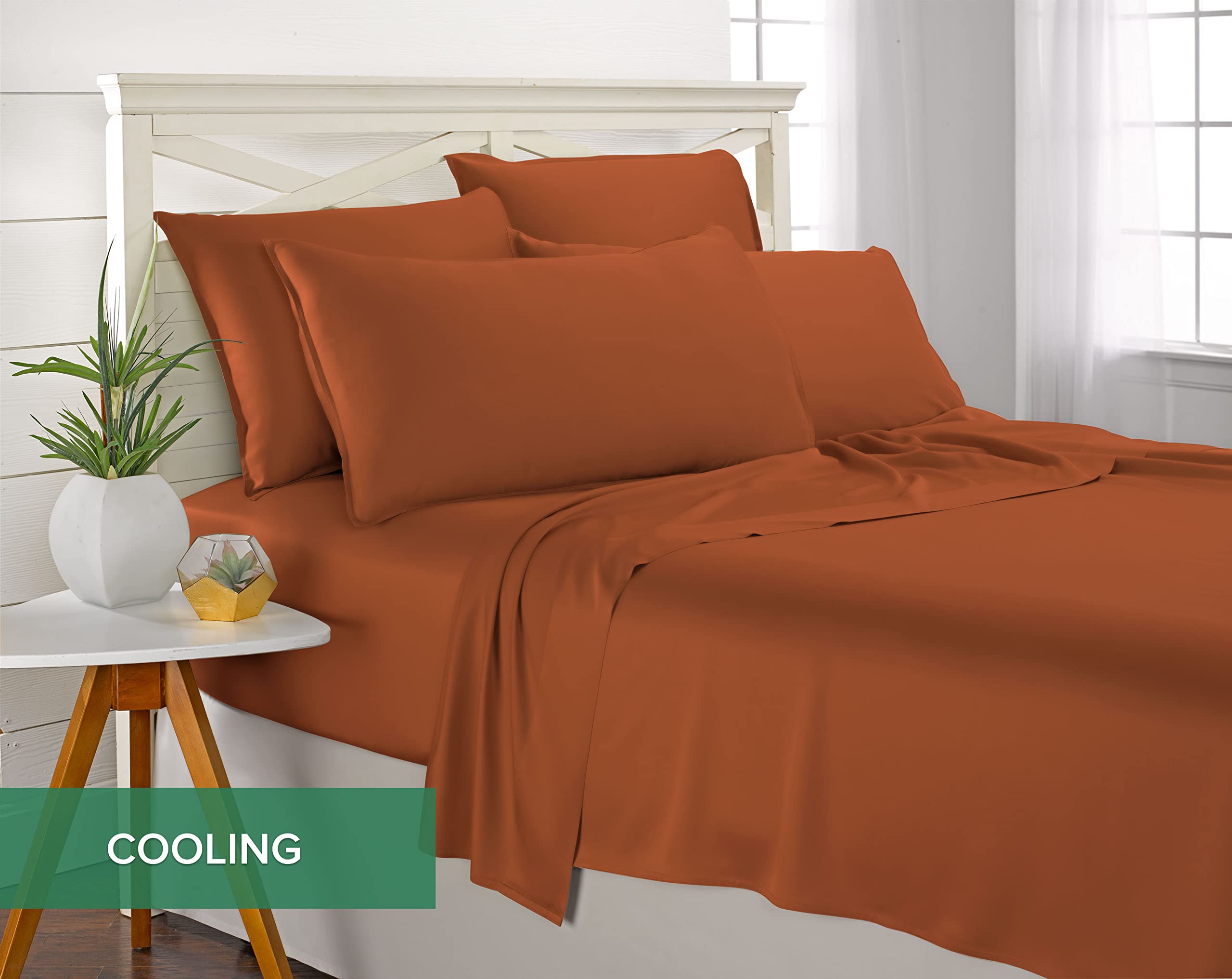 Pure Bamboo made bed in styled bedroom showing terracotta sheets warming the room
