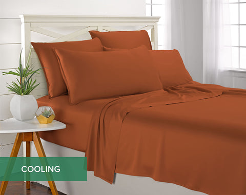 Pure Bamboo made bed in styled bedroom showing terracotta sheets warming the room