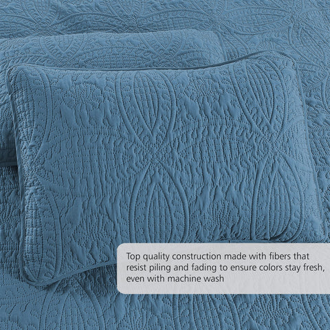 Pure Bedding quilt in a styled bedroom demonstrates versatile ash blue color and easy coordination with decor