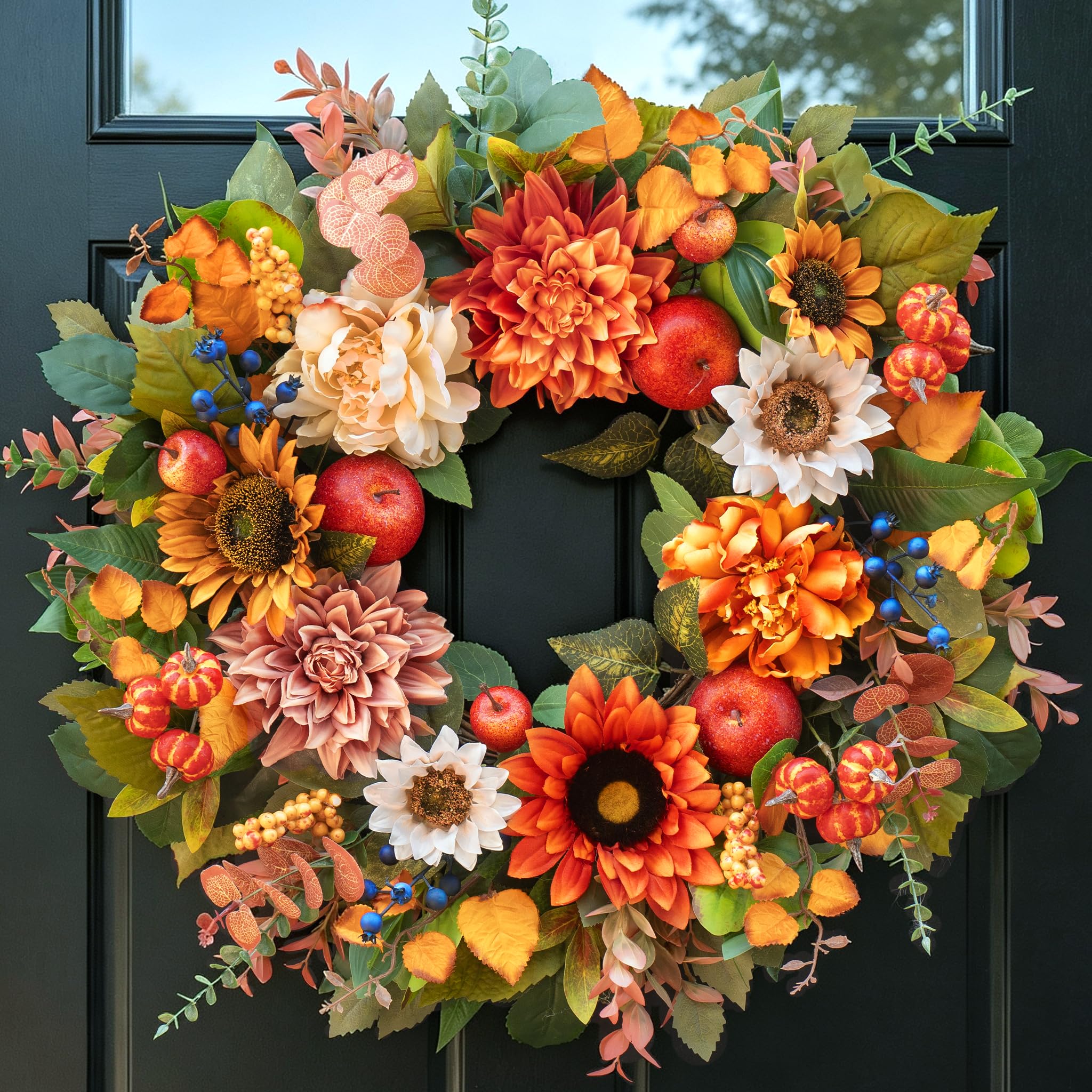 PureCosy front door wreath displayed on a wooden door, inviting seasonal curb appeal