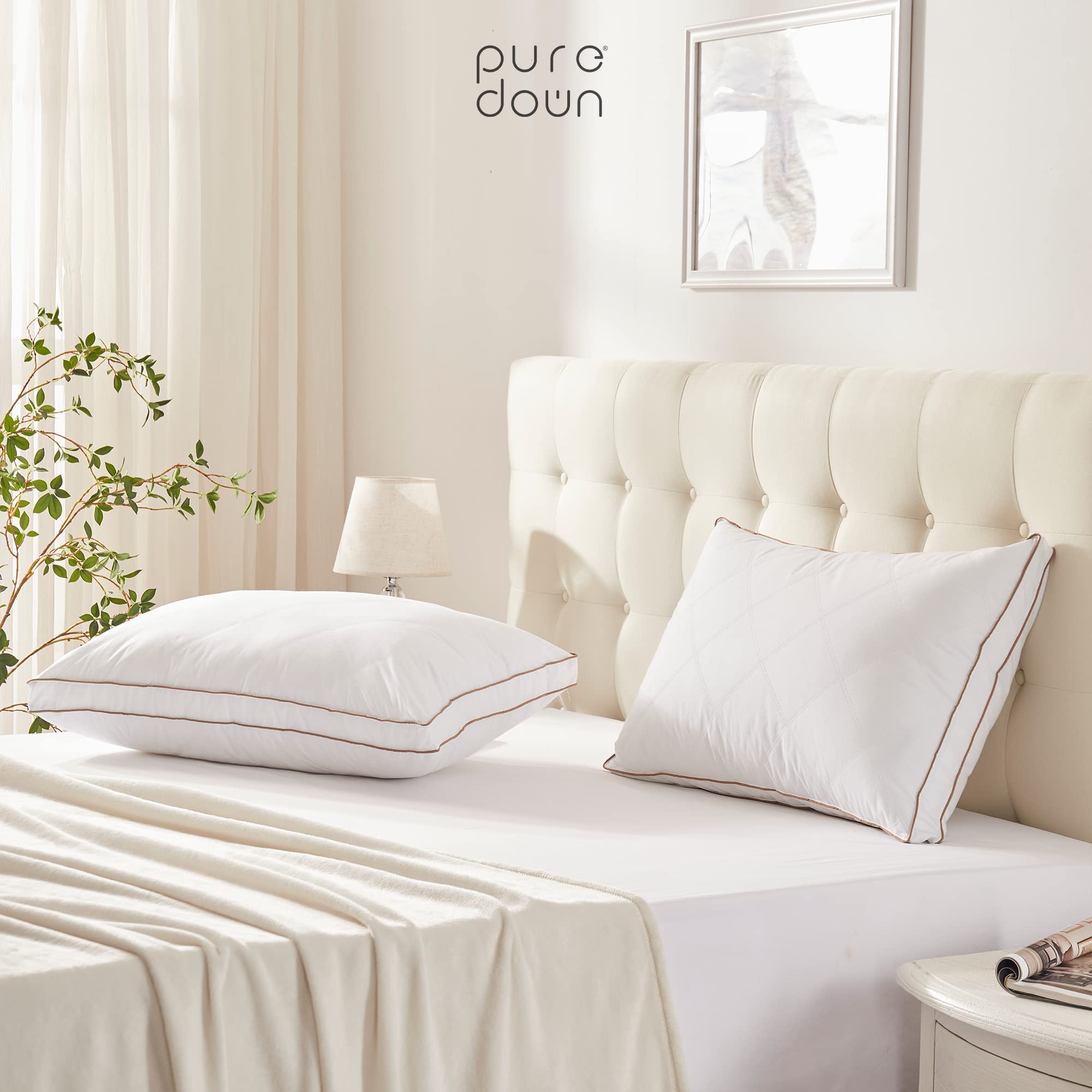 puredown pair of pillows on a made bed conveying luxury comfort at home