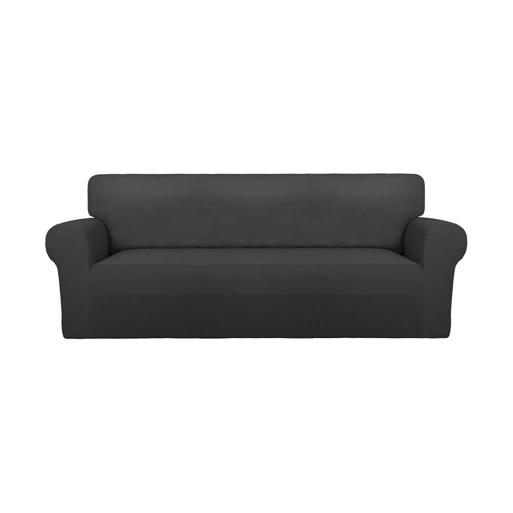 PureFit front view on oversized sofa showing full coverage and refreshed look