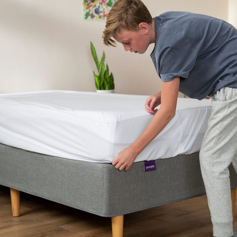 Purple in use family bed scene demonstrating protection from kids and pets
