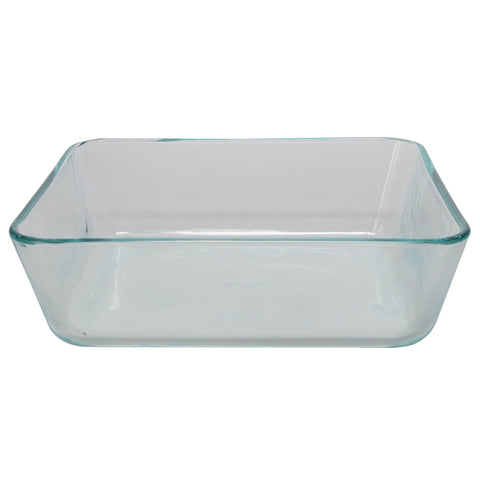 Pyrex dish beside measuring cup illustrating the 11-cup capacity