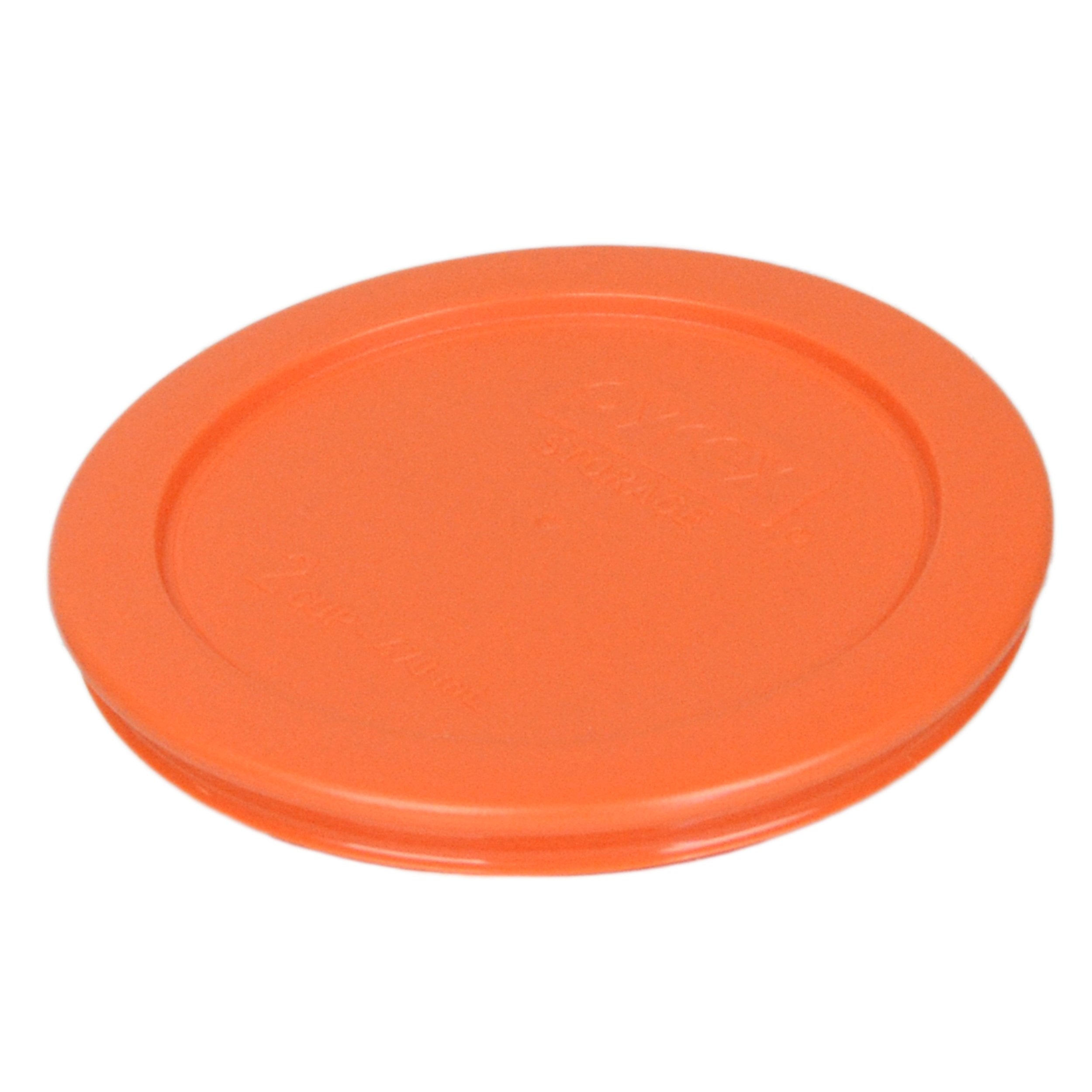 Pyrex close-up of 7200 orange lid on glass bowl showing secure fit and spill protection