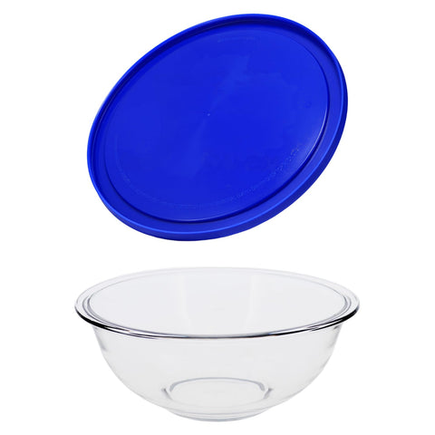Pyrex bowl beside measuring cup for scale showing practical 2.5-quart capacity