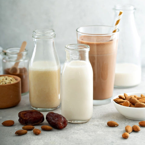 QAPPDA bottles with smoothies stored in fridge demonstrating space-saving and visibility