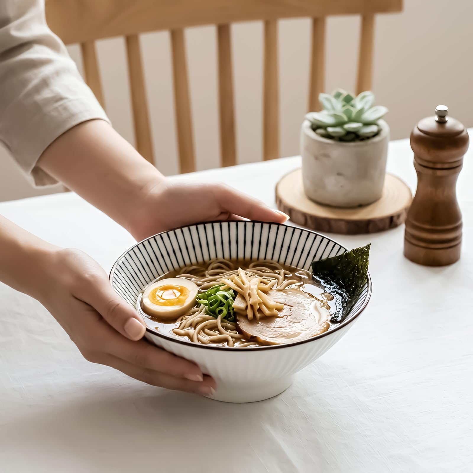 QINLANG bowl beside spoon showing scale and generous capacity