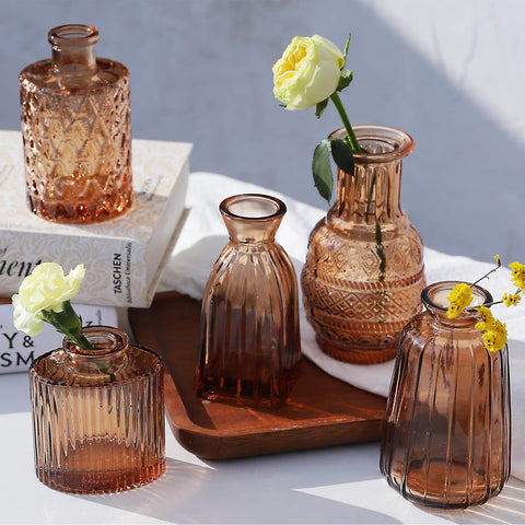 QLOFEI vase beside a hand showing scale and easy single-stem use