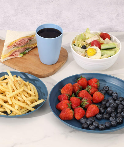 Quatish plates next to utensils showing scale and everyday usability in kitchen