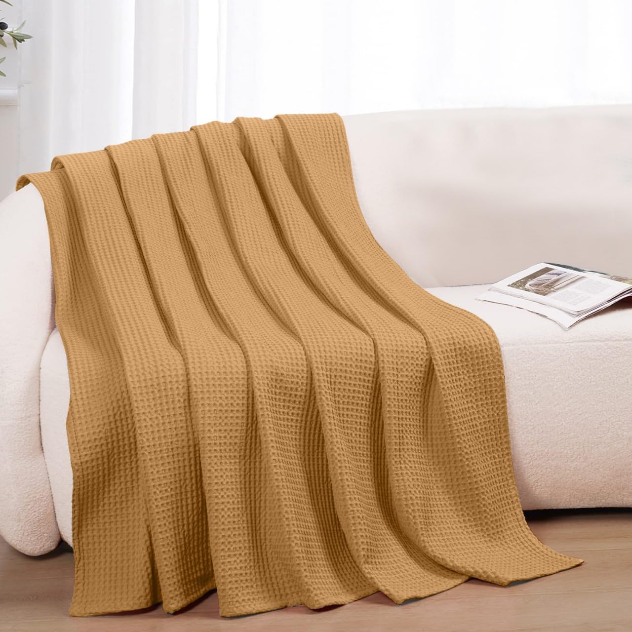 QUBA LINEN folded on sofa highlights versatile styling and comfort