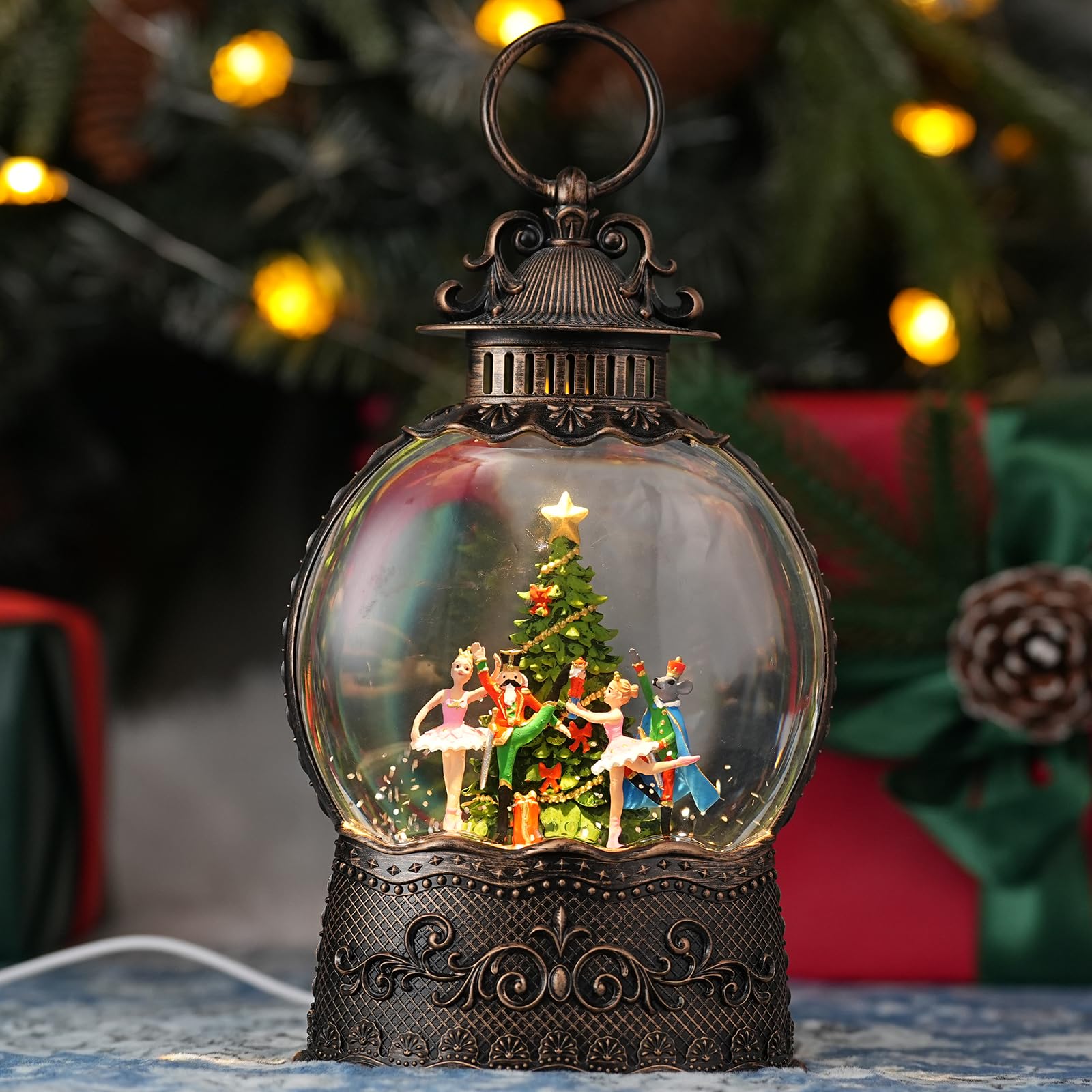 Qukulov snow globe front view showing festive figures and warm glow benefit