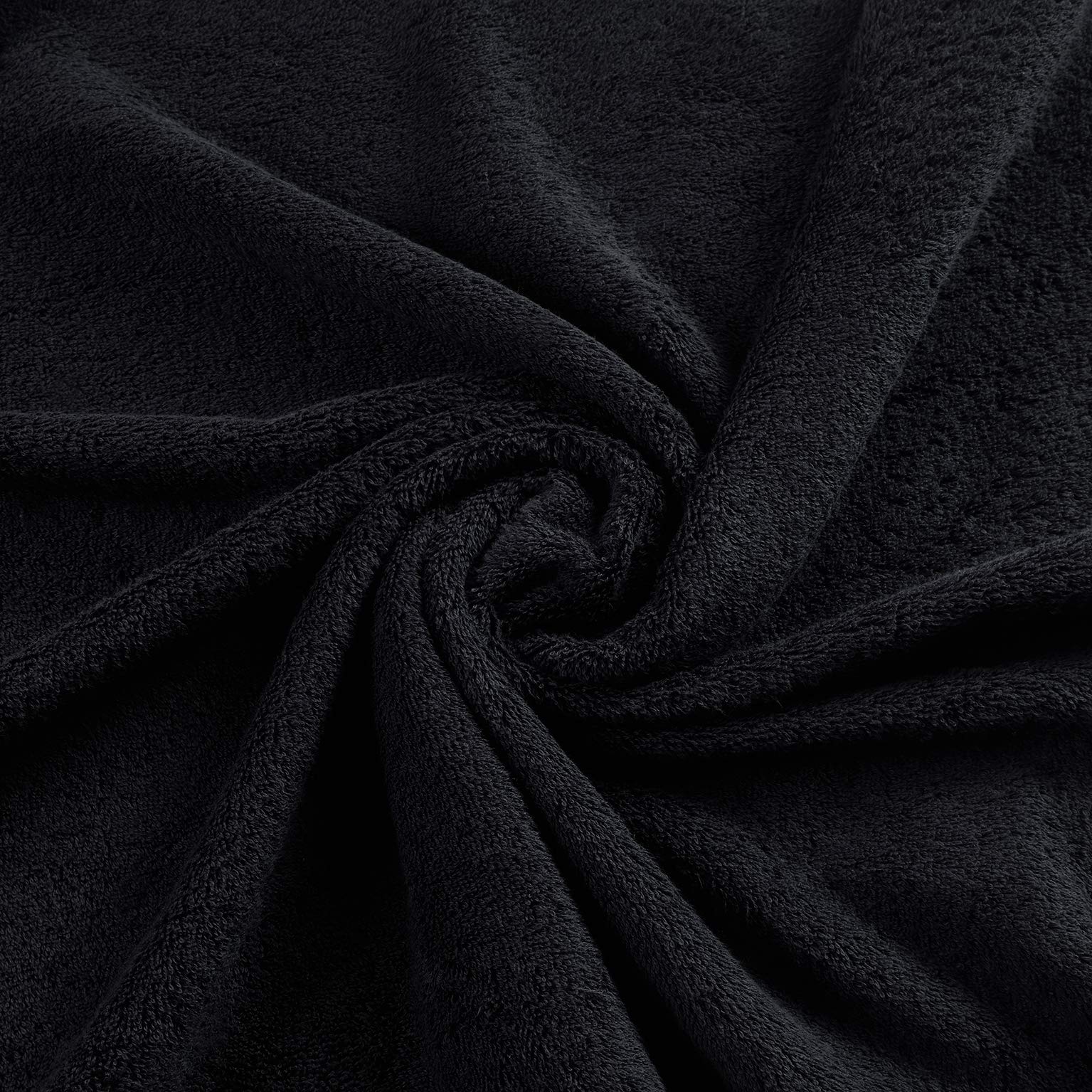 Qute Home towel absorbing water from a spill demonstrating absorbency performance
