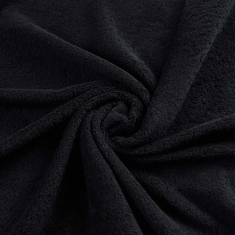 Qute Home towel absorbing water from a spill demonstrating absorbency performance