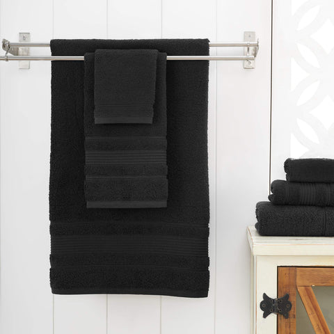 Qute Home towel flat on floor showing true 27x54 size and coverage
