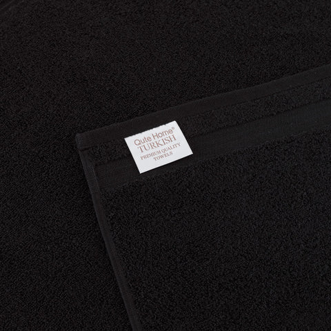 Qute Home towels stacked on shelf showing coordinated storage and tidy look
