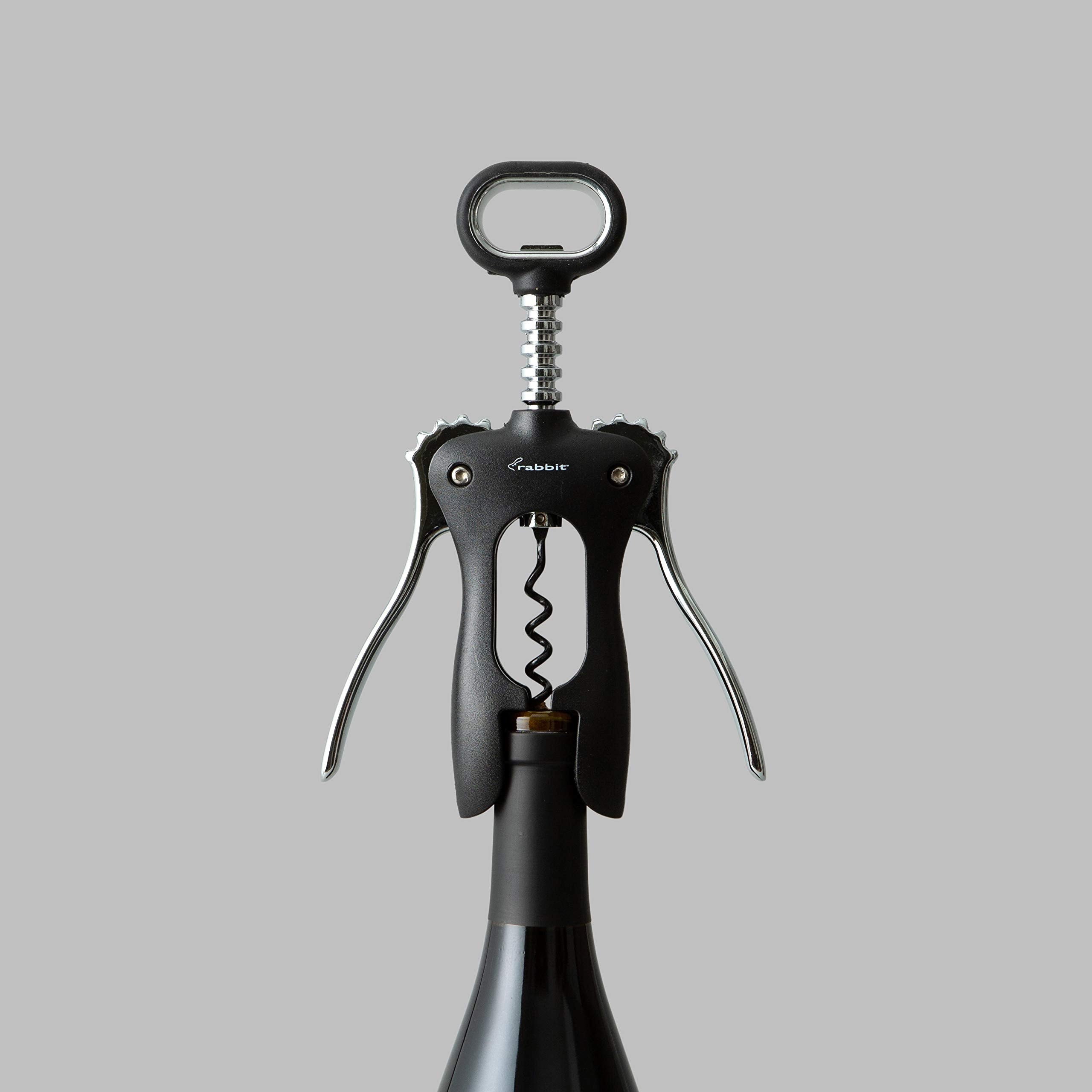 Rabbit classic wing corkscrew next to wine bottle for scale showing universal fit and size