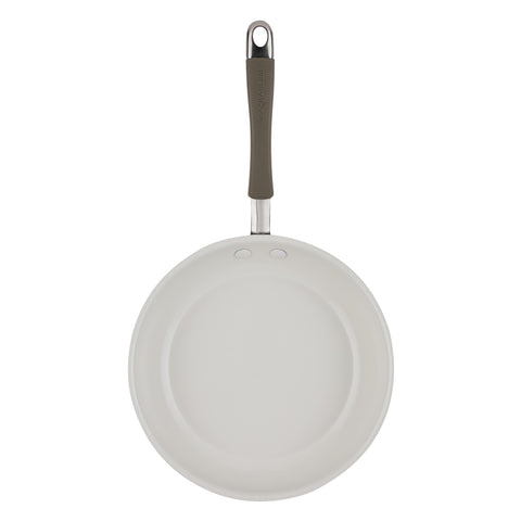 Rachael Ray cookware next to plate to show real-world size and serving benefit
