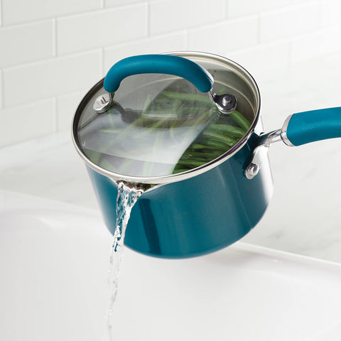 Rachael Ray tempered glass lid close-up highlighting built-in strainer benefit