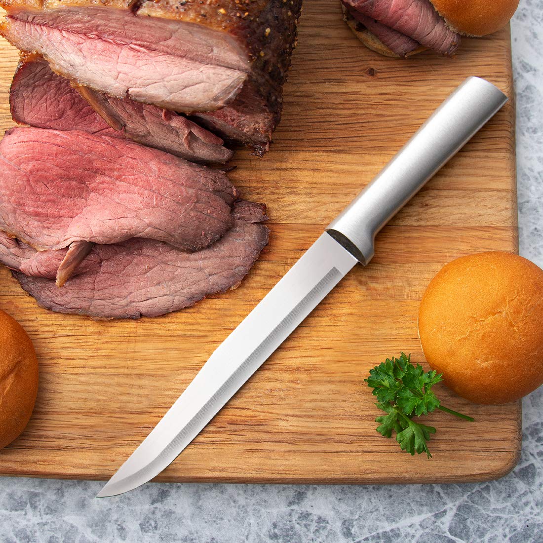 RADA knives next to ruler on cutting board to show scale and kitchen convenience benefit