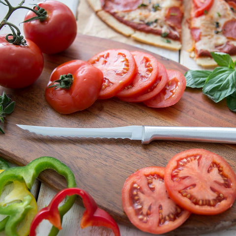 RADA tomato slicer held in hand to show scale and easy everyday control