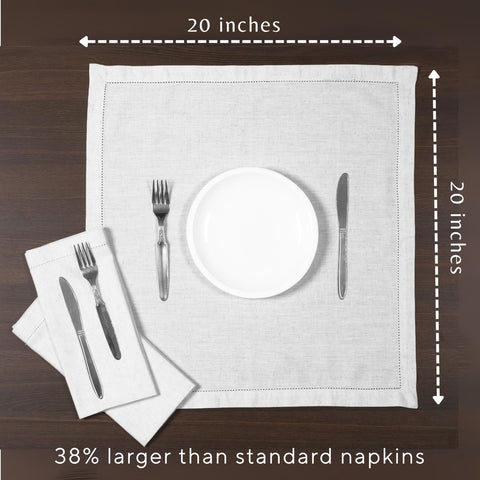 Ramanta Home hand holding napkin to show true 20x20 inch scale and generous coverage