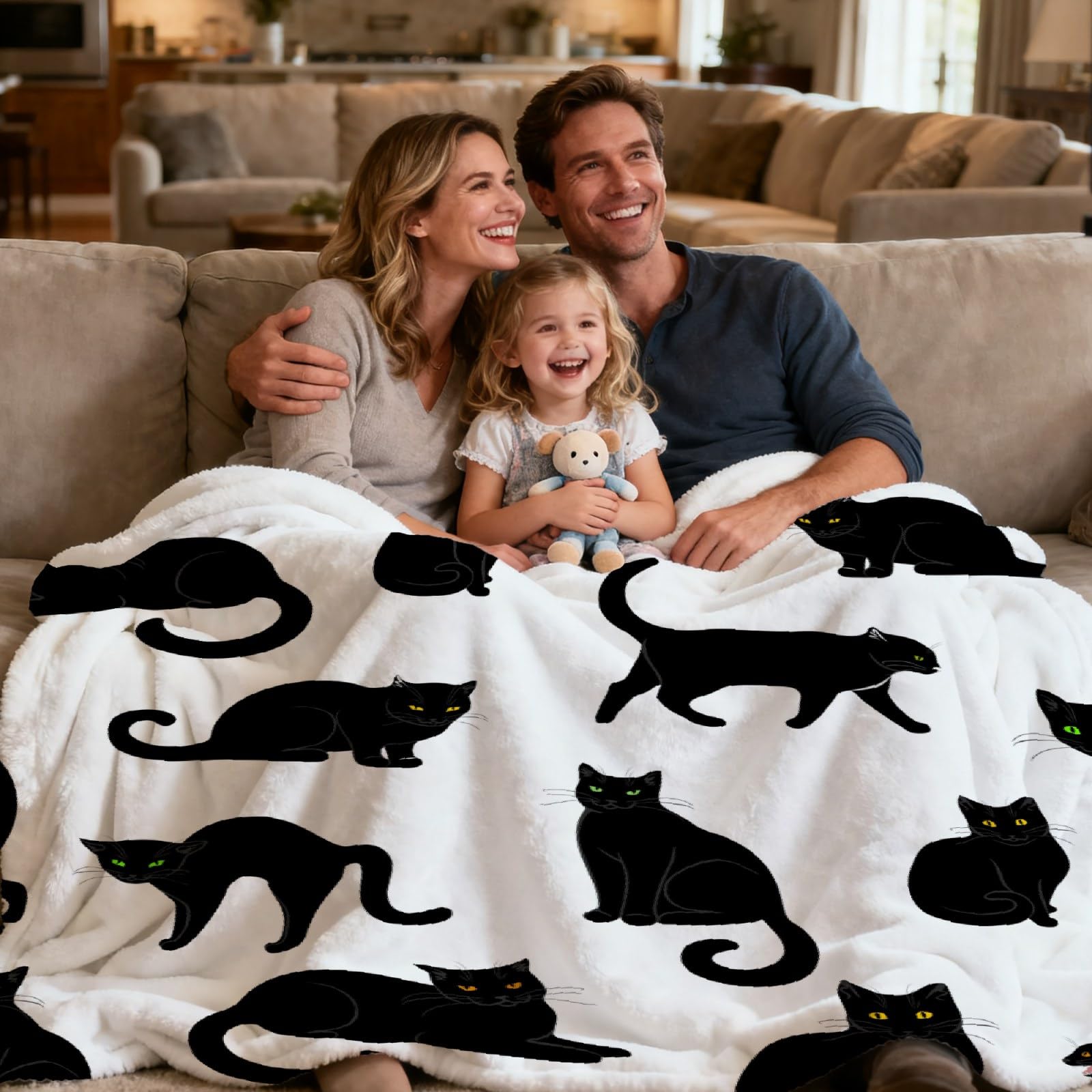 RAMEN BLANKET draped over sofa with black cat motif adding seasonal style and warmth