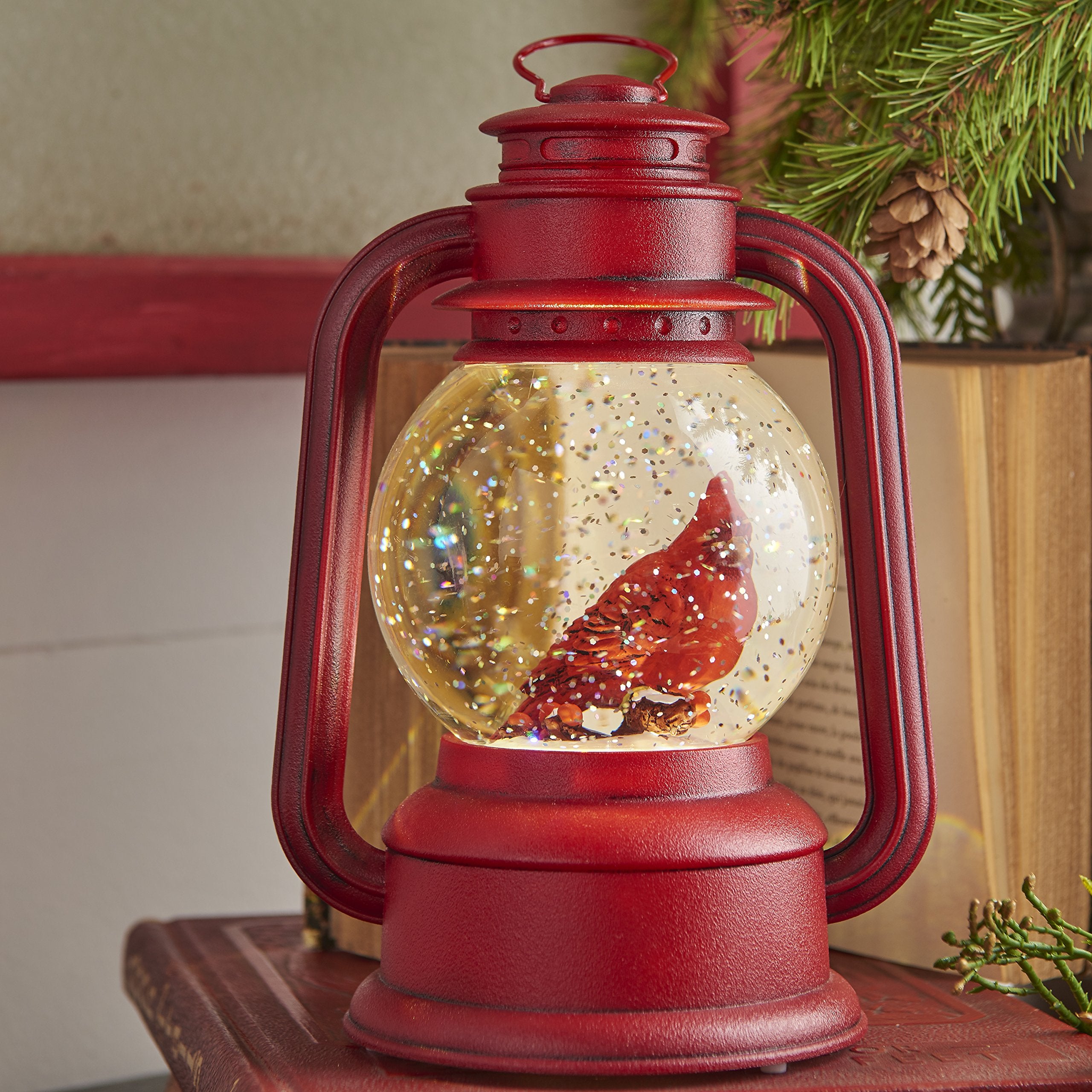 RAZ Imports close-up of cardinal globe showing swirling glitter detail