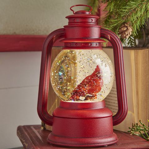 RAZ Imports close-up of cardinal globe showing swirling glitter detail