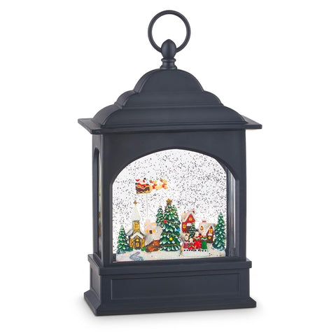 RAZ Imports flying Santa front view showing lit scene and swirling glitter for festive ambiance