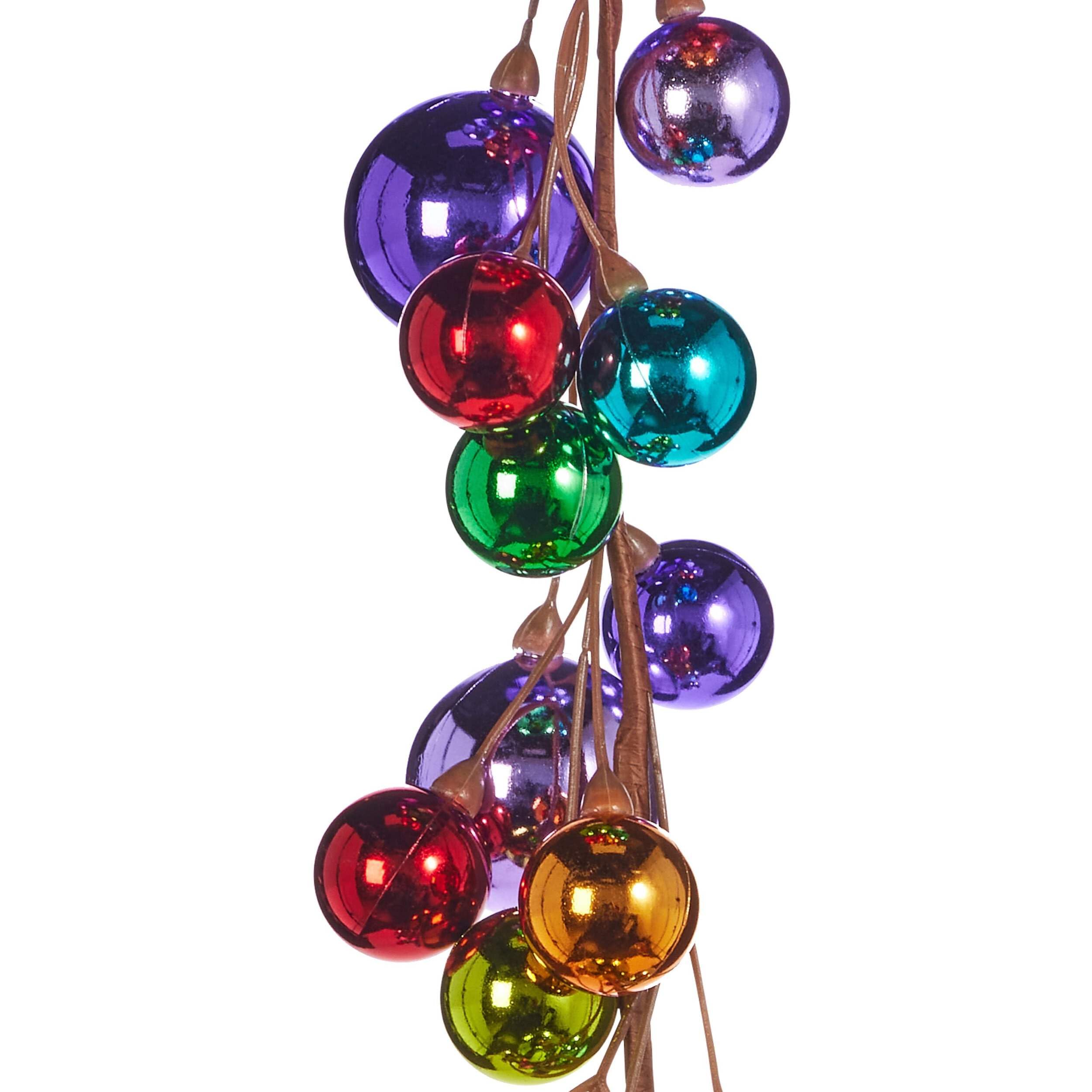 RAZ Imports garland woven into wreath adding depth and vibrant red