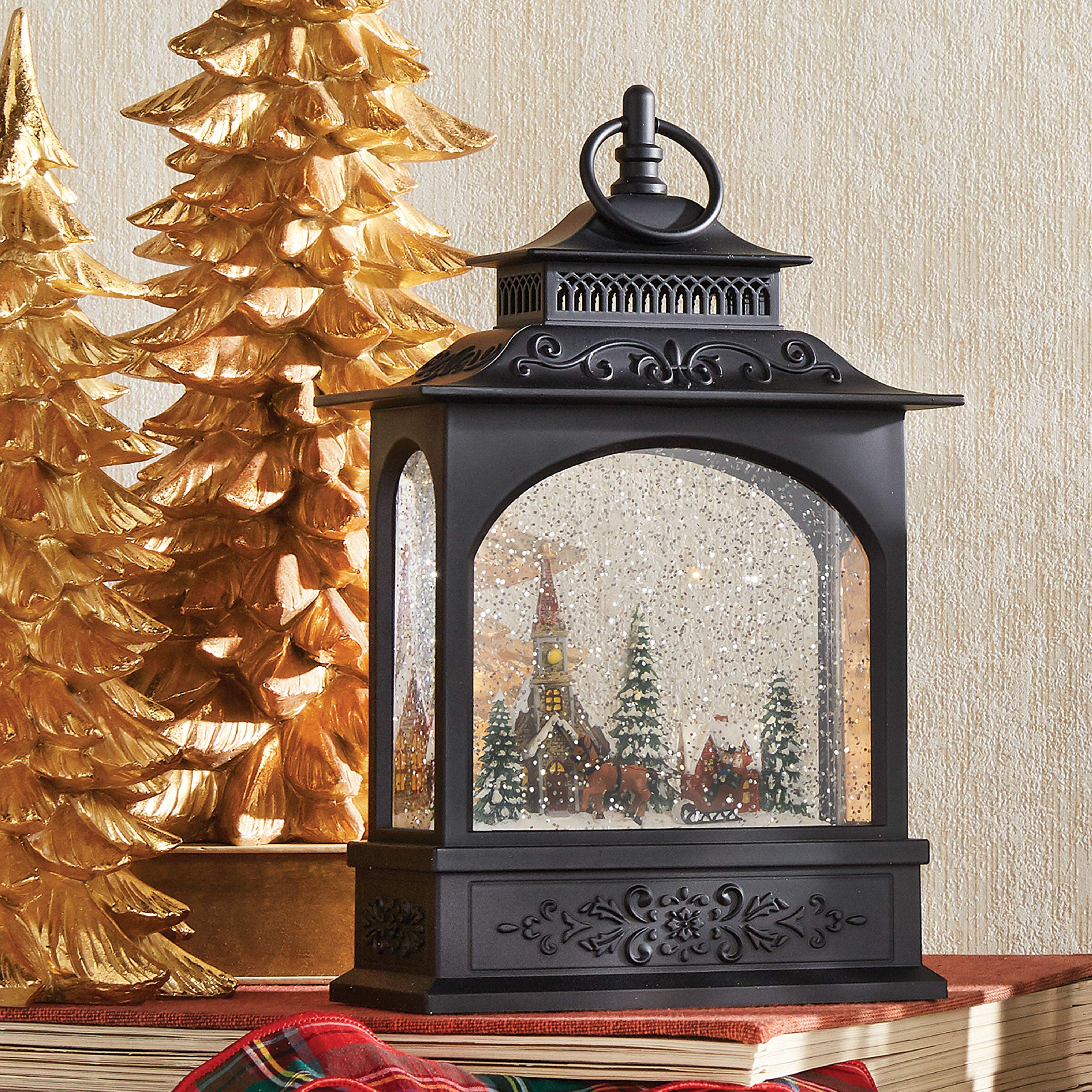 RAZ Imports close-up of sleigh and trees highlighting textured detail and glitter motion benefit