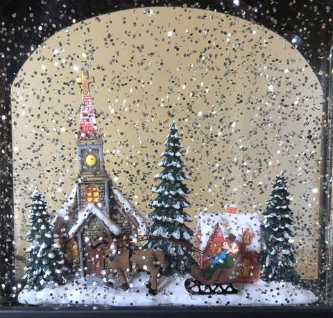 RAZ Imports lantern on mantel with holiday decor showing ambient light and festive mood benefit