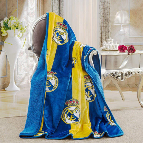 Real Madrid throw front view showing crest and smooth flannel face for fan display
