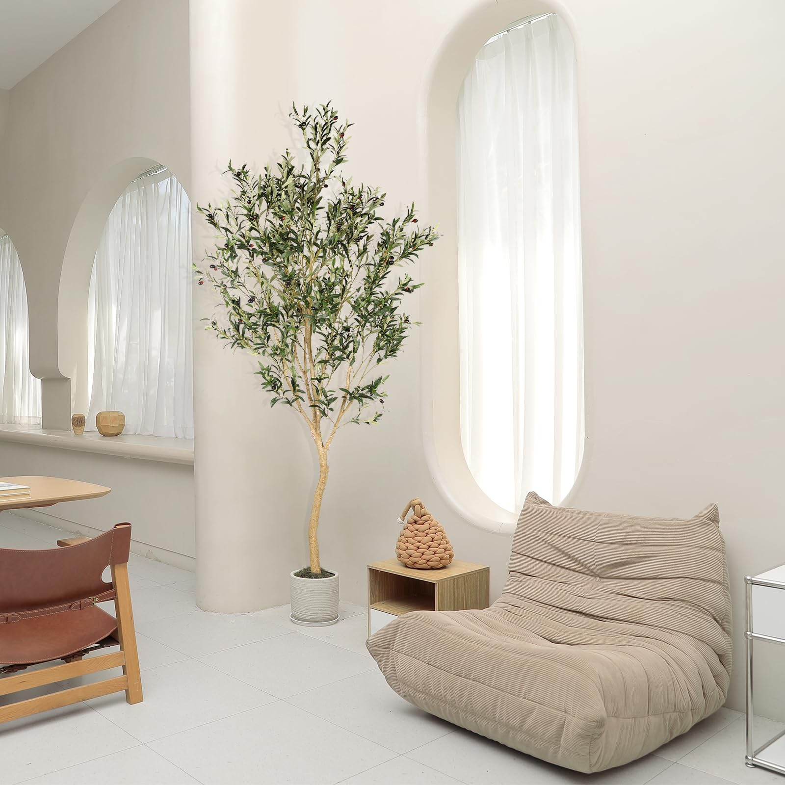 REALEAD olive tree beside sofa to show 8ft scale and room-filling presence