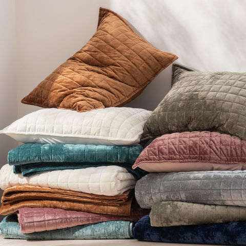 RECYCO folded quilt on chair illustrating scale and easy storage convenience