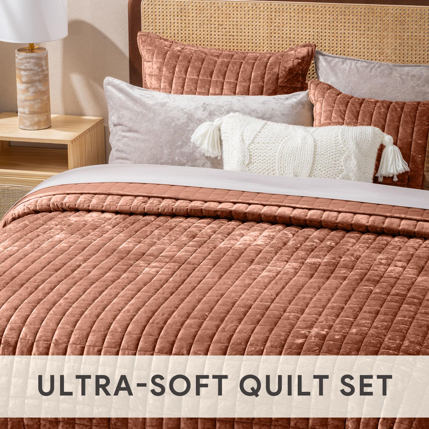 RECYCO quilt on styled bed in bedroom demonstrating warm color and layered look