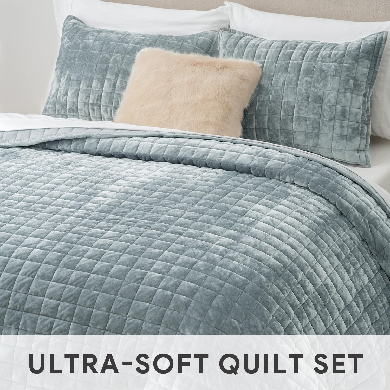 RECYCO quilt styled on bed showing how the blue linen complements décor